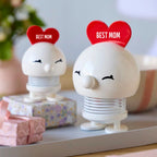 Zwei weisse Hoptimistinnen mit dem roten Herz auf dem Kopf. Eine in der Grösse S und eine in der Grösse M