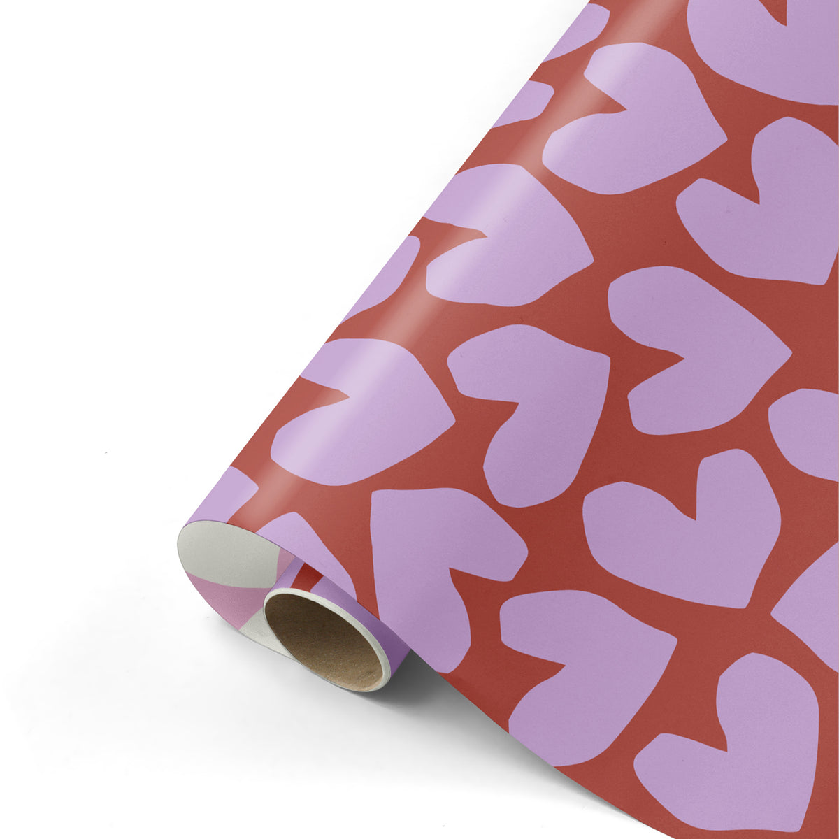 Eine Rolle Geschenkpapier mit rosa Herzen auf bordeauxfarbenem Hintergrund