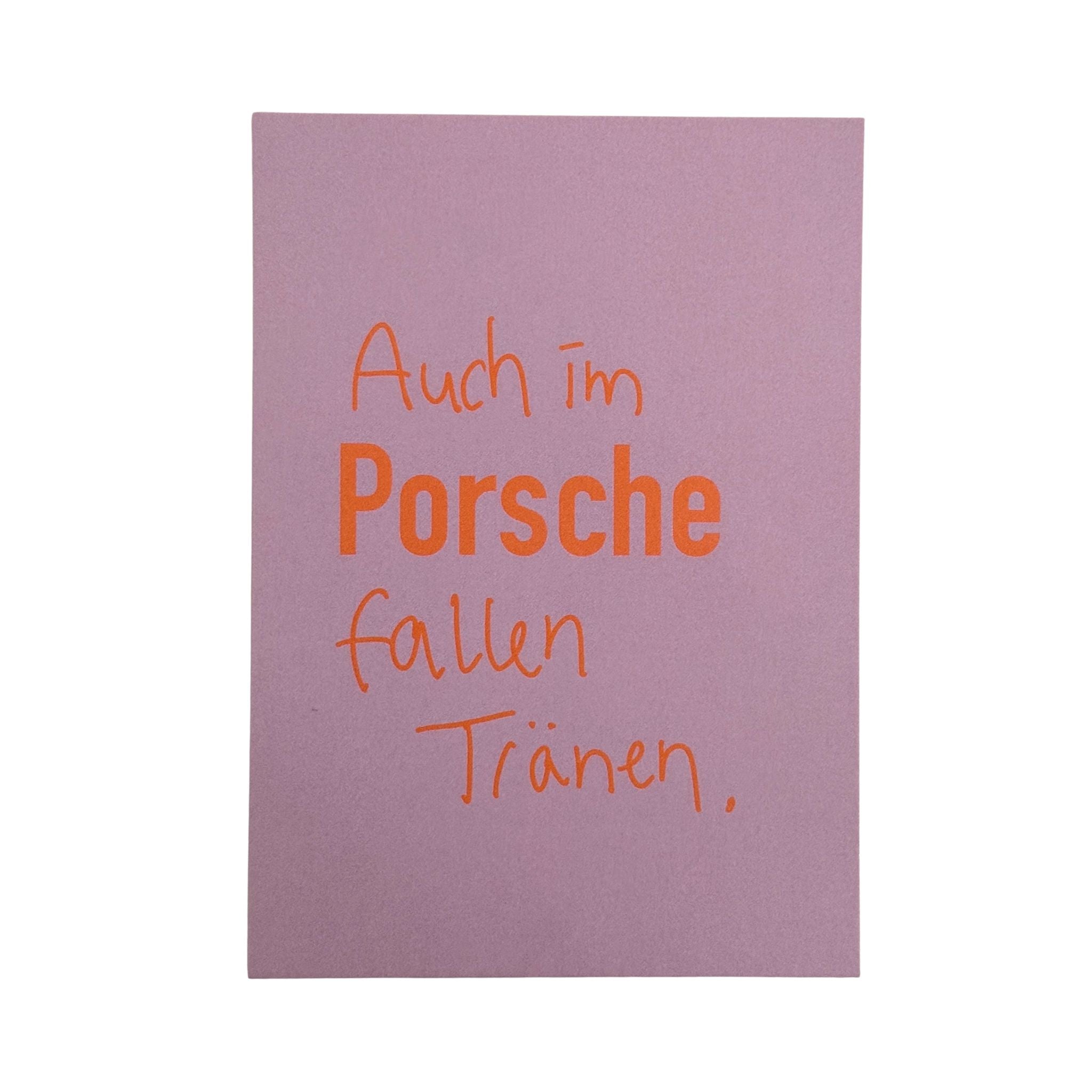 Postkarte von Ute Arnold mit Spruch, auch im Porsche fallen Traenen. Orange Schrift auf rosa Hintergrund.