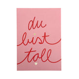 Rosa farbene Postkarte mit dem Schriftzug "du bist toll".