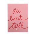 Rosa farbene Postkarte mit dem Schriftzug "du bist toll".